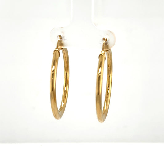 Pair of polished 14K yellow gold tube hoop earrings with latch backs.