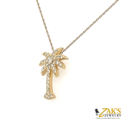 14K yellow gold palm tree pendant pavé-set with round diamonds on chain.