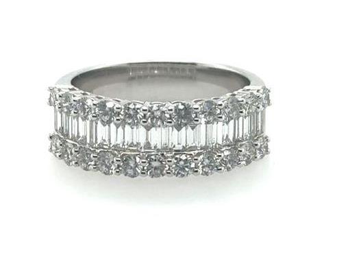 18K white gold band with channel-set baguette diamonds flanked by prong-set round diamonds.
