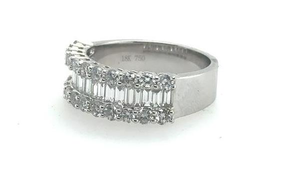 18K white gold band with center baguette diamonds flanked by round diamond rows.