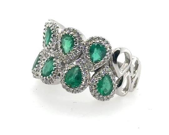 18K white gold ring with pear-shaped emeralds haloed by round diamonds.