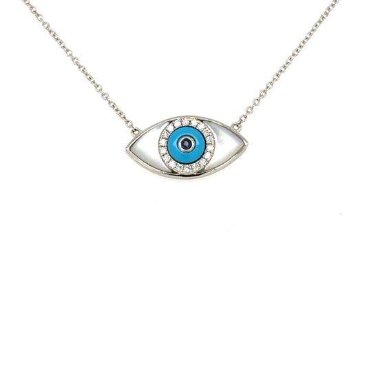 18K white gold evil eye pendant with mother-of-pearl, turquoise, diamonds, sapphire.