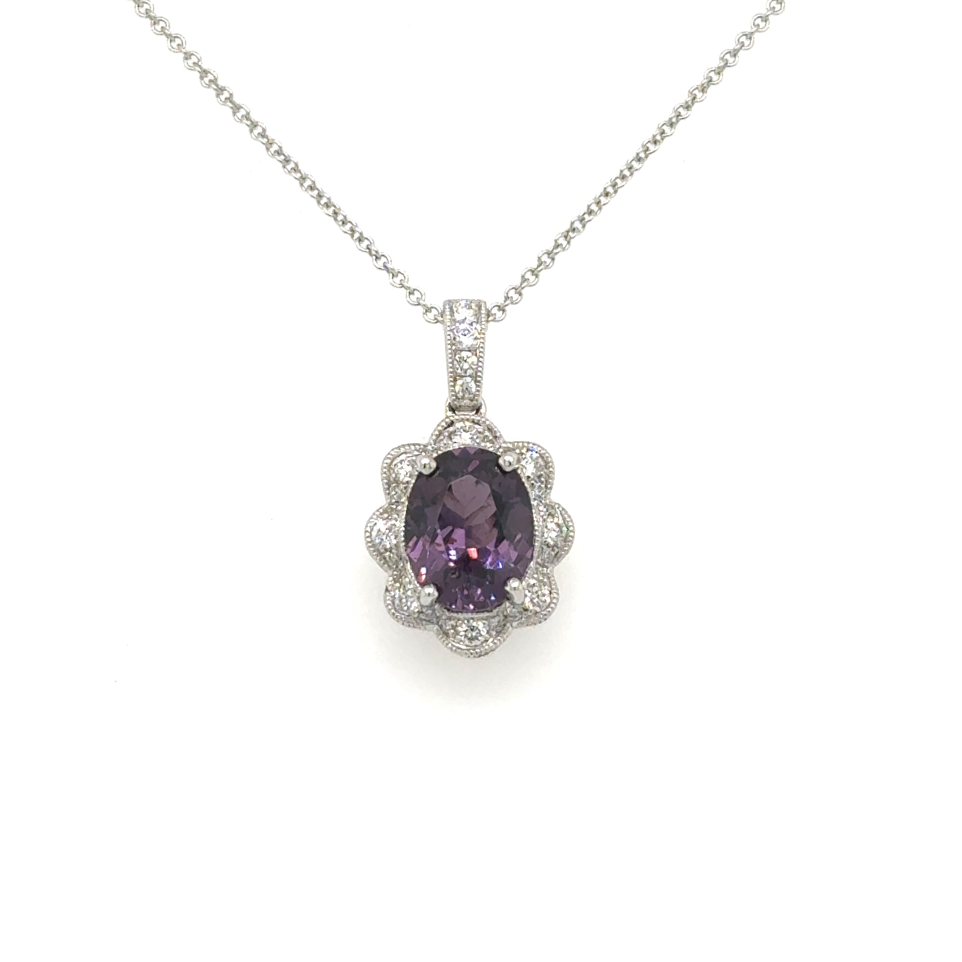 18K white gold necklace with oval purple spinel and scalloped diamond halo.