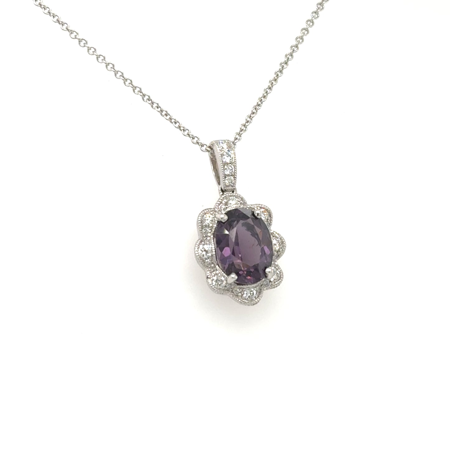 18K white gold necklace with oval purple spinel and scalloped diamond halo.