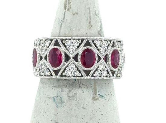 18K white gold wide band with bezel-set oval rubies and pavé diamonds.
