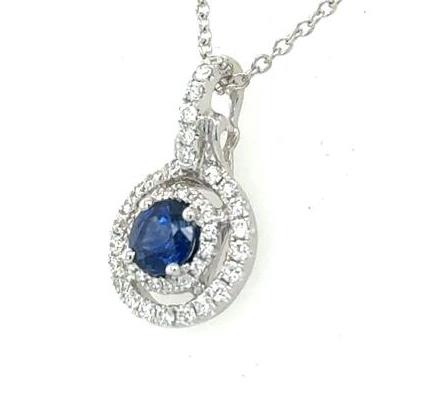 18K white gold pendant with oval blue sapphire and double diamond halo on chain.