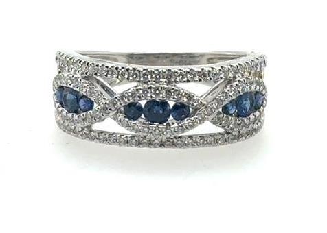 18K white gold band with diamond pavé and infinity-set round blue sapphires.