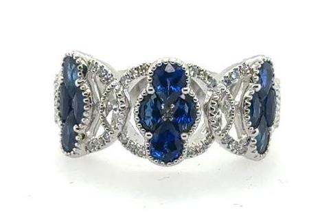 18K white gold ring with oval and marquise blue sapphires and diamond accents.