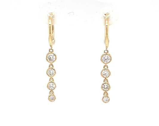 18K yellow gold hoop earrings with four graduated bezel-set round diamond drops.