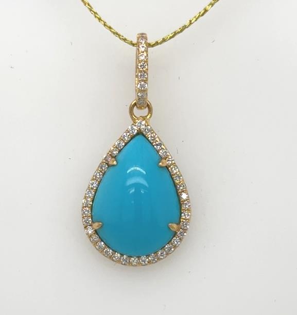 18K yellow gold pendant with pear cabochon turquoise and diamond halo bail.