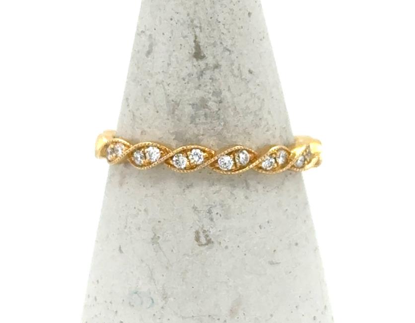 18K yellow gold twisted band with shared-prong round diamonds in marquise stations.