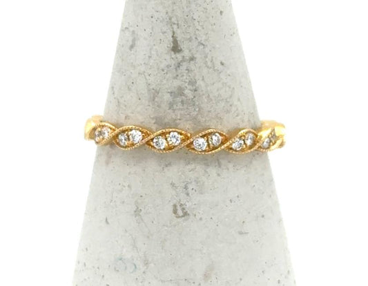 18K yellow gold twisted band with shared-prong round diamonds in marquise stations.