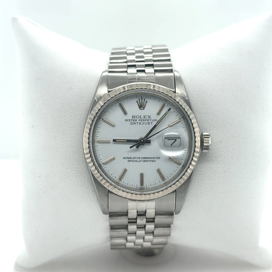 Stainless steel Rolex Datejust with white dial, fluted bezel, date Cyclops, jubilee bracelet.
