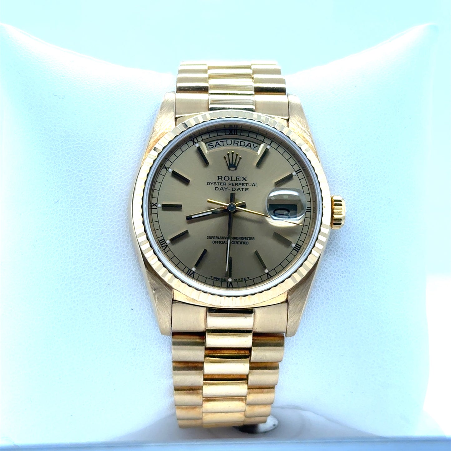 18K yellow gold Rolex Day-Date, champagne dial, fluted bezel, President bracelet.