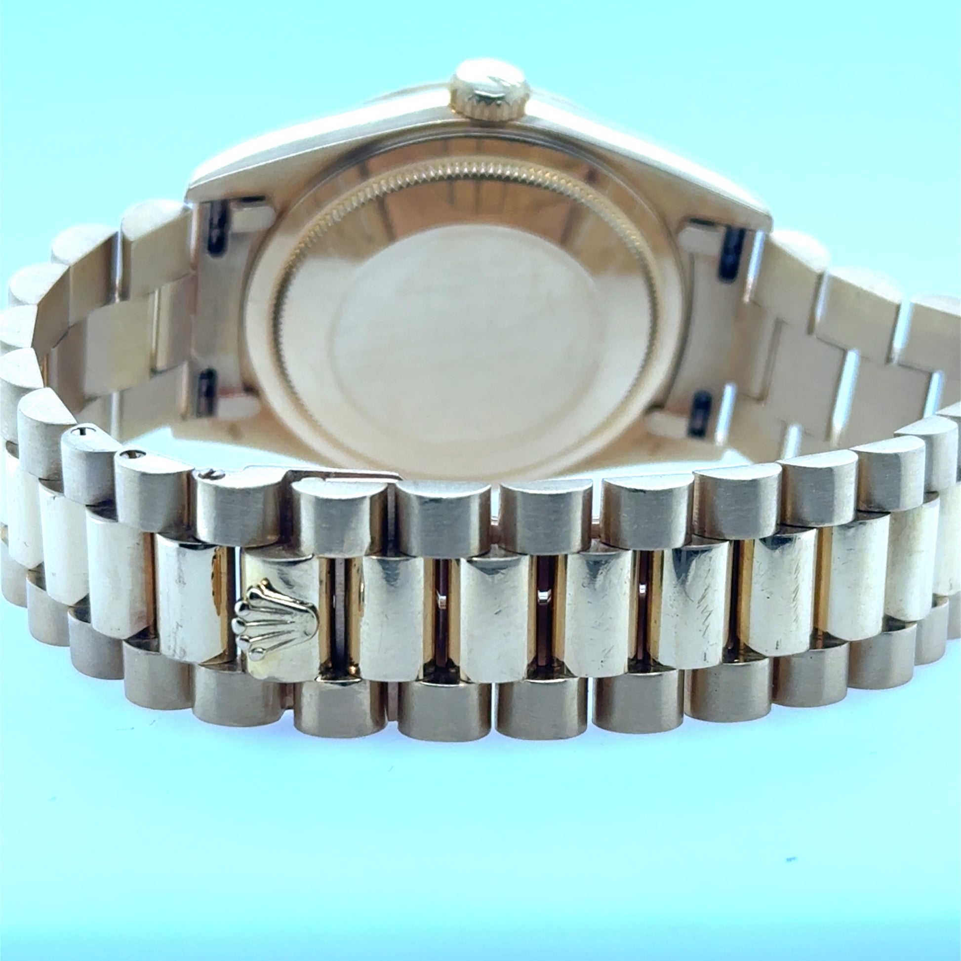18K yellow gold Day-Date case back with President bracelet and crownclasp.