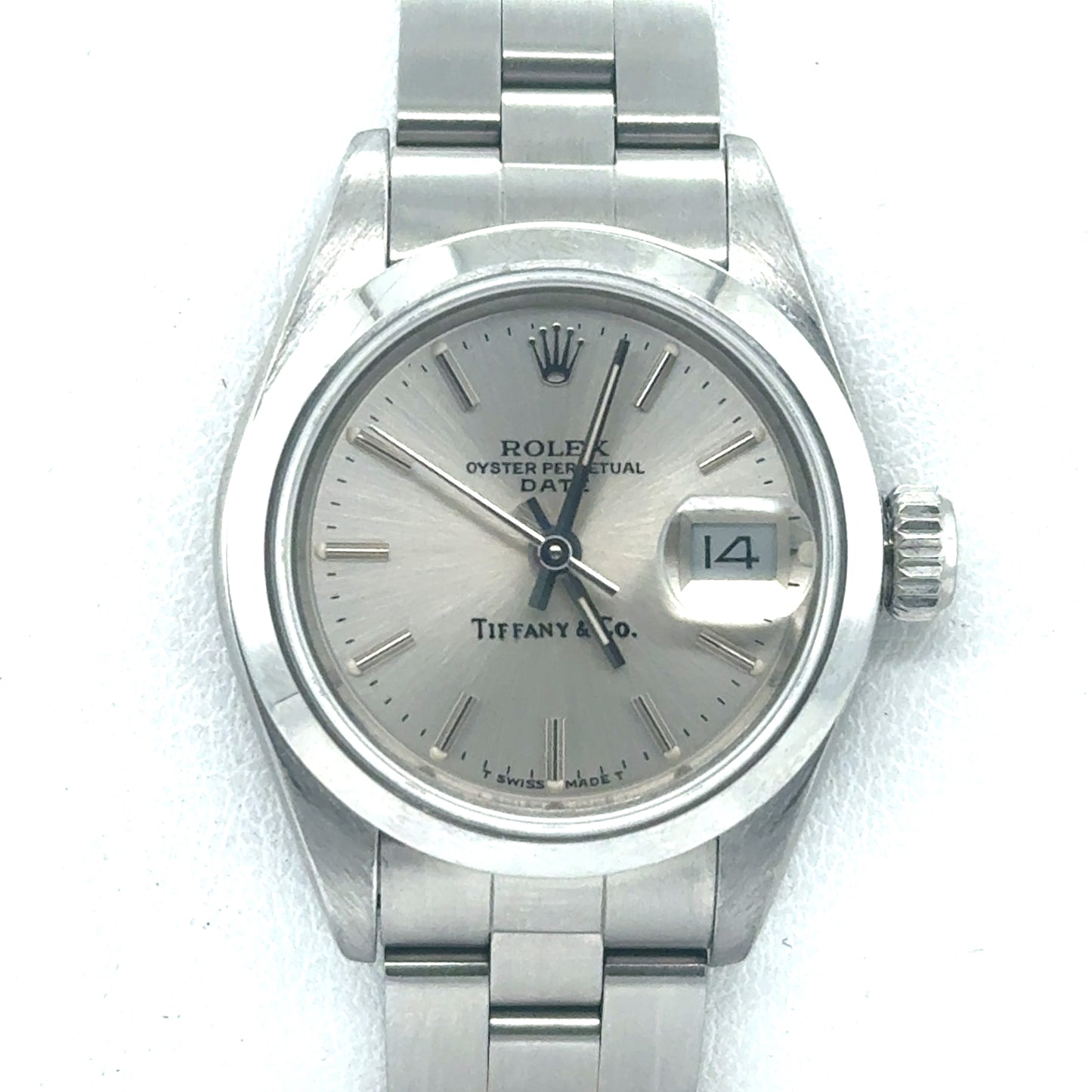Stainless steel Rolex Date 26mm with silver dial, date window, and Oyster bracelet.