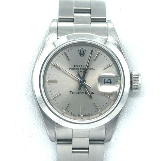 Stainless steel Rolex Date 26mm with silver dial, date window, and Oyster bracelet.