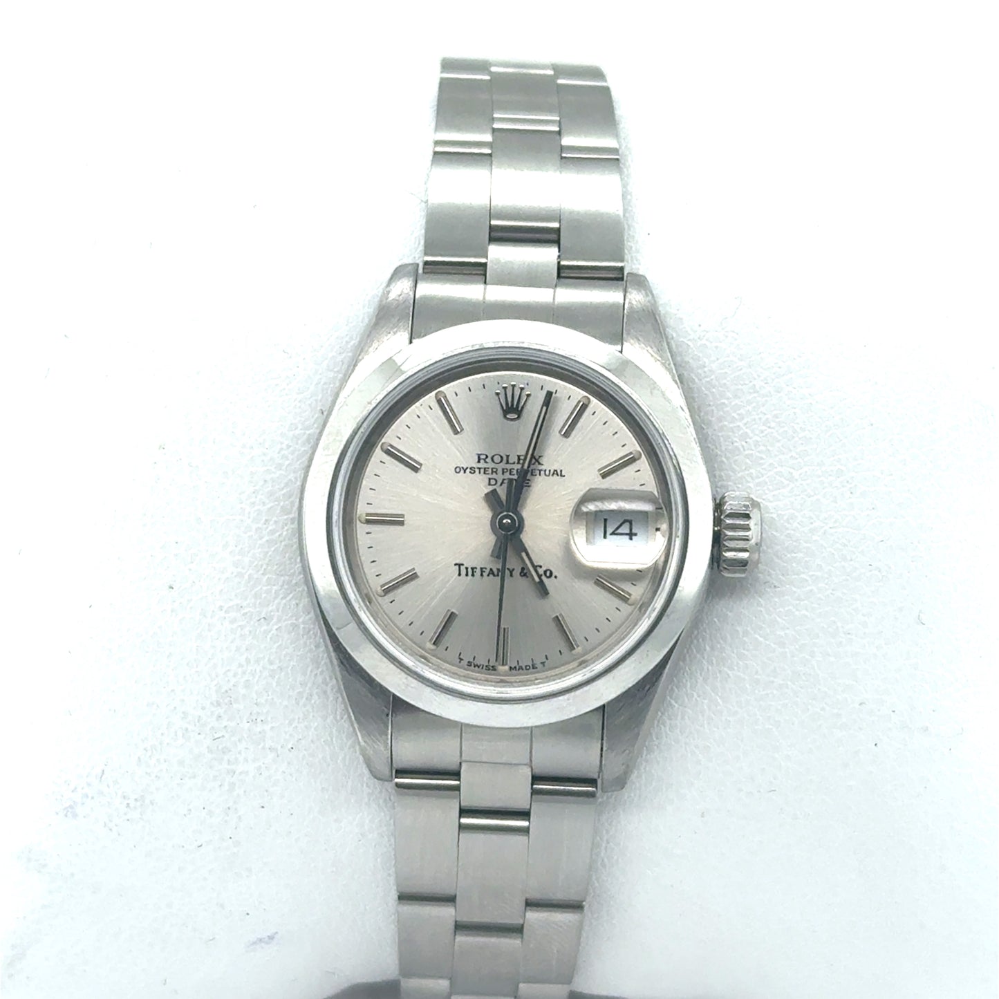 Stainless steel Rolex ladies watch with silver dial, date window, and Oyster bracelet.