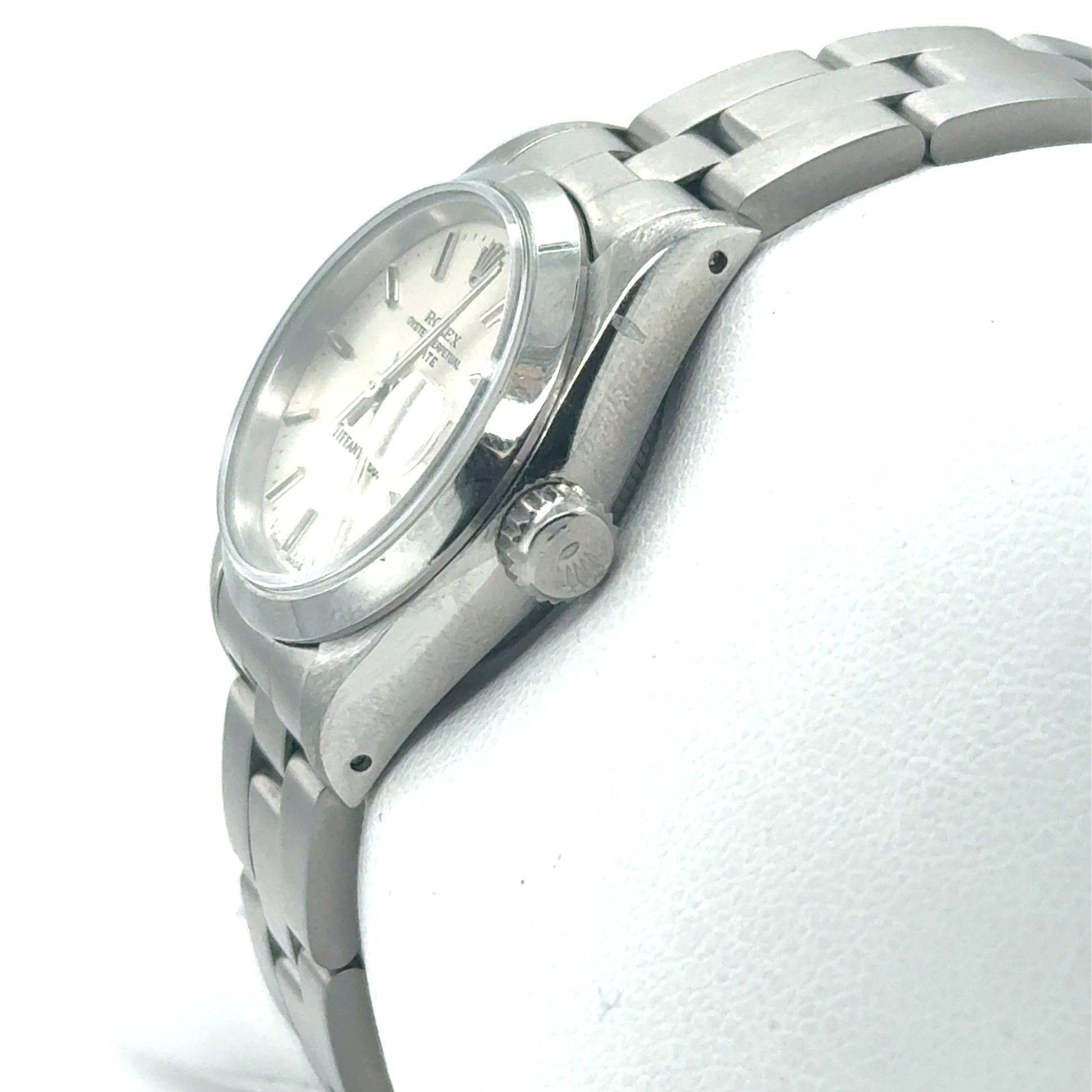 Stainless steel Rolex ladies watch with silver dial, oyster bracelet, and crown.
