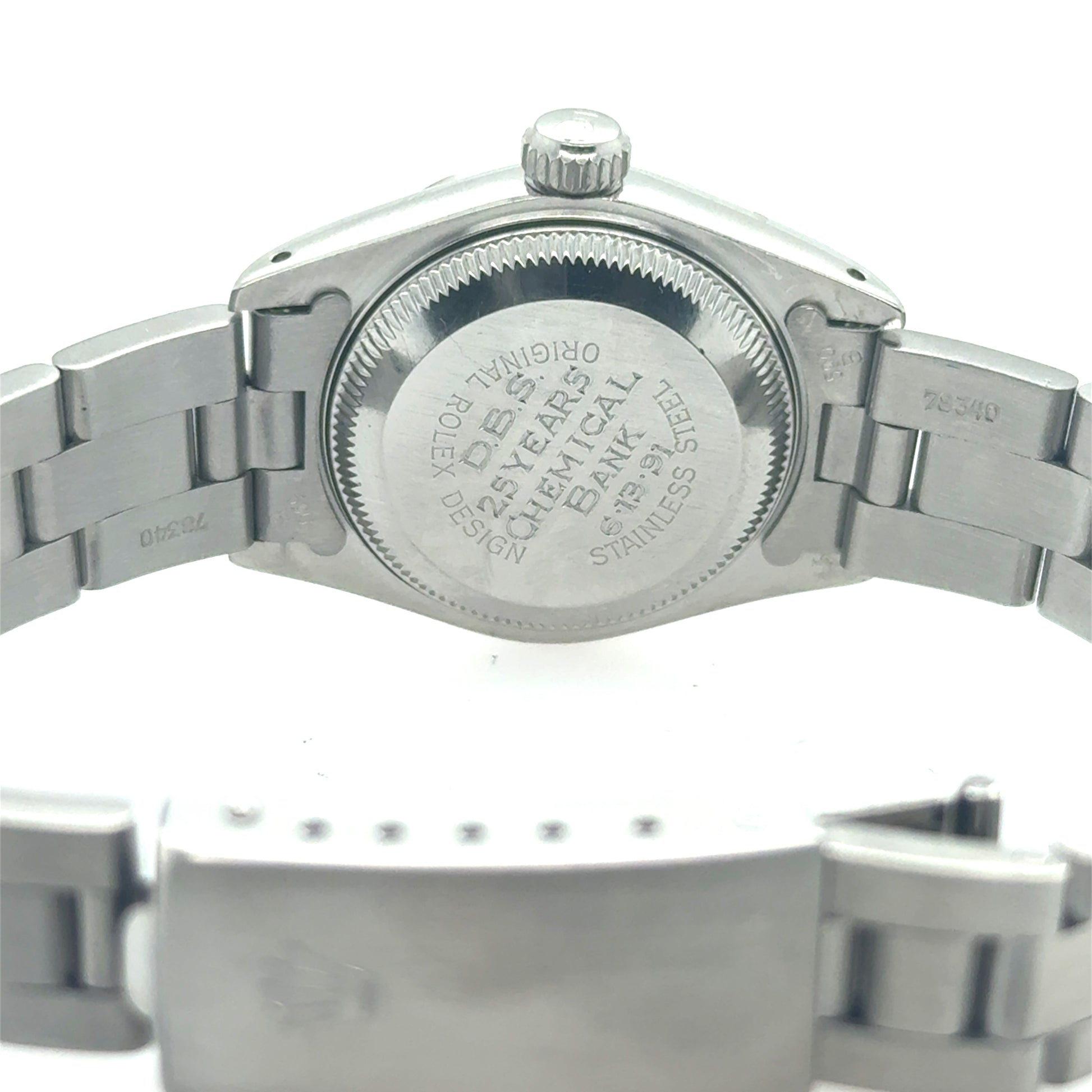 Stainless steel Rolex Oyster bracelet watch showing engraved screw-down caseback and fold-over clasp.