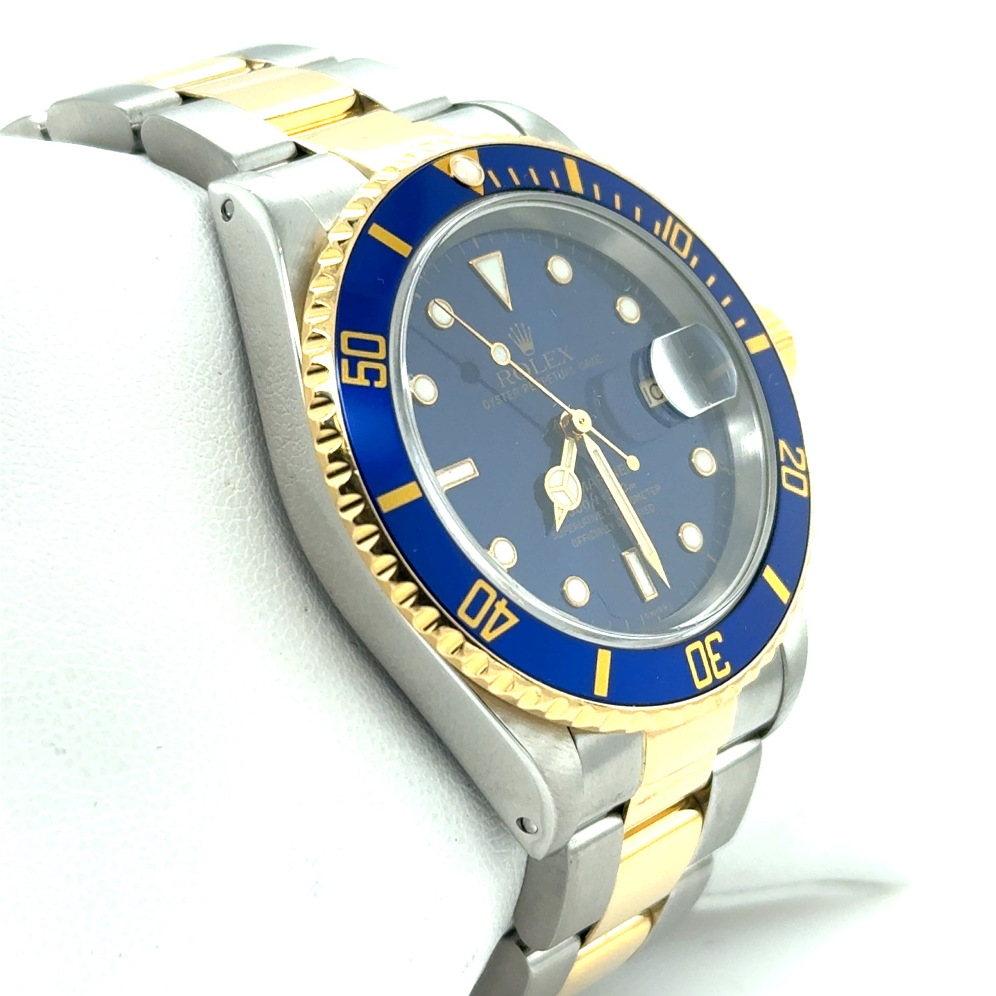 Two-tone stainless steel and yellow gold Submariner with blue dial and bezel.