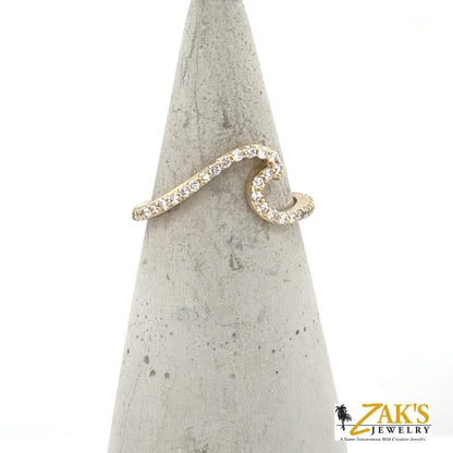 14K yellow gold wave ring with shared-prong round diamond pavé band.
