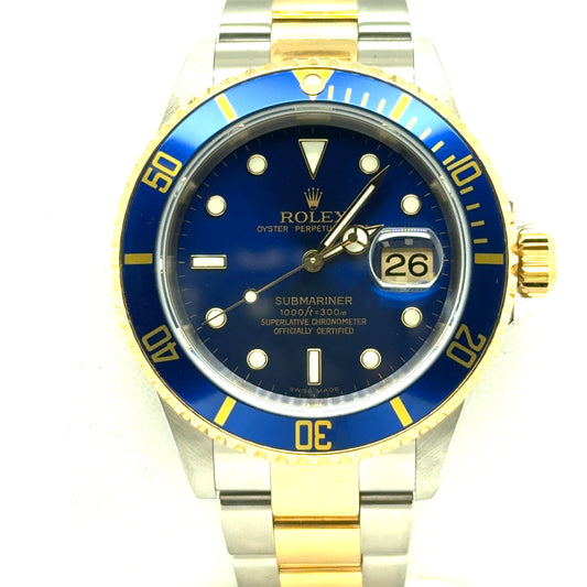 Two-tone stainless steel and yellow gold Submariner with blue dial, blue bezel, date magnifier.