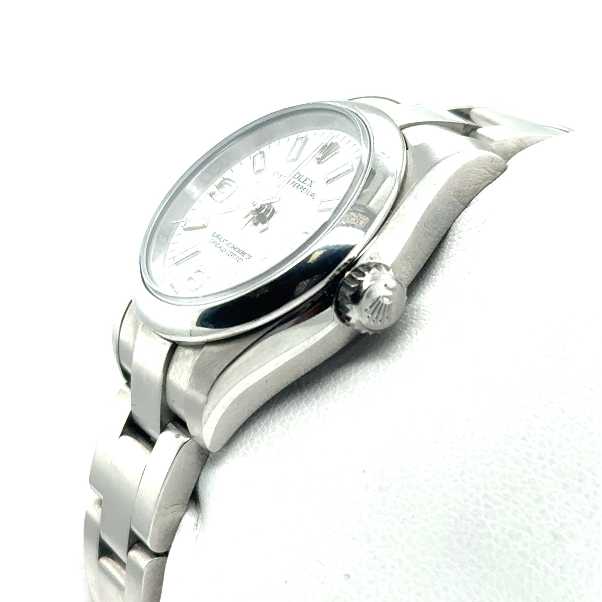 Stainless steel ladies watch with white dial, domed bezel, and Oyster bracelet.