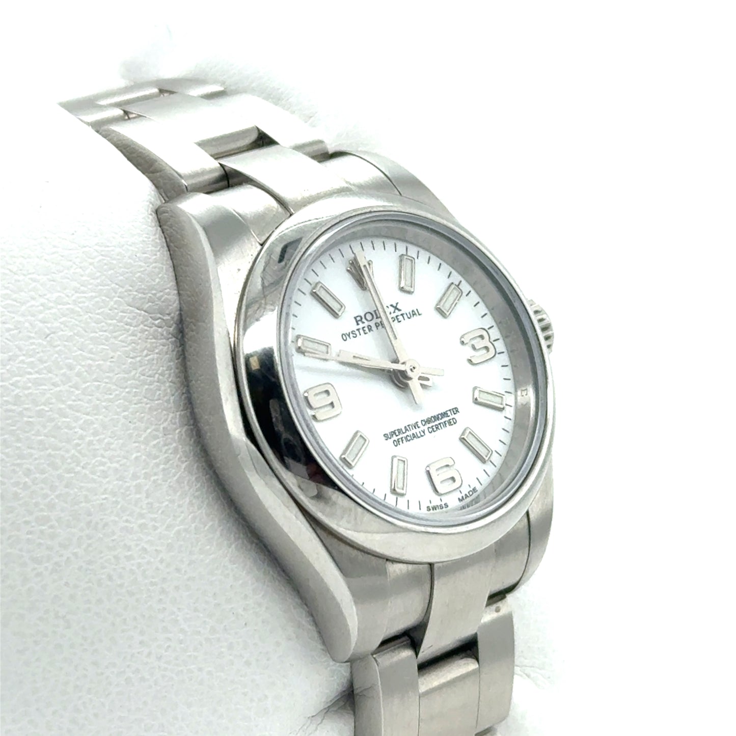 Stainless steel Rolex Oyster Perpetual with white dial, baton markers, and 3-6-9 numerals.
