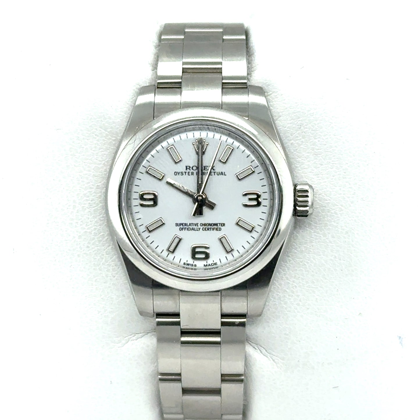 Stainless steel Rolex Oyster Perpetual watch with white dial and Arabic numerals.