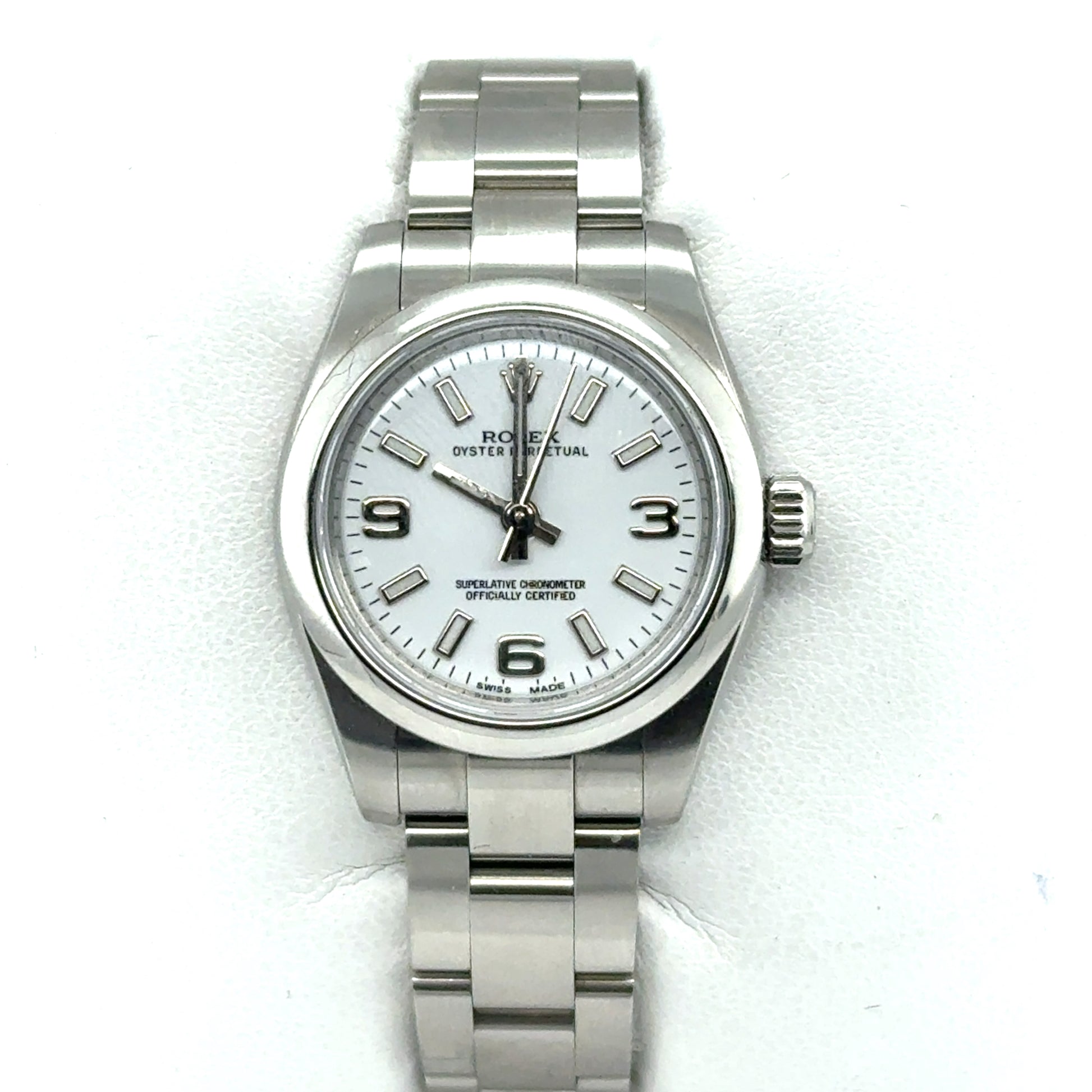 Stainless steel Rolex Oyster Perpetual watch with white dial and Arabic numerals.