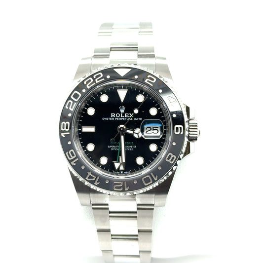 Stainless steel Rolex GMT‑Master II with black dial, black‑gray 24‑hour bezel, date magnifier, and Oyster bracelet.