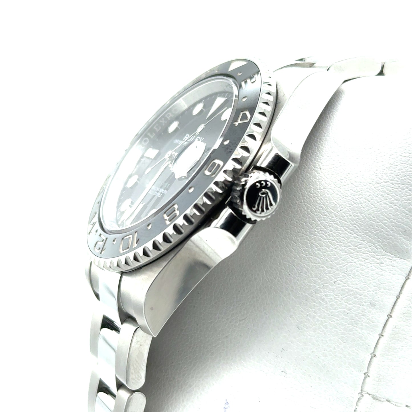 Stainless steel GMT watch with black dial, black‑gray ceramic bezel, Oyster bracelet.