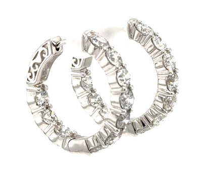 14K white gold inside-out hoop earrings with round diamonds and locking backs.