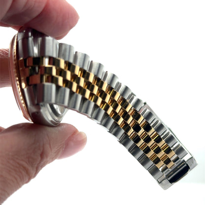 Two-tone stainless steel and yellow gold Jubilee bracelet with folding clasp.