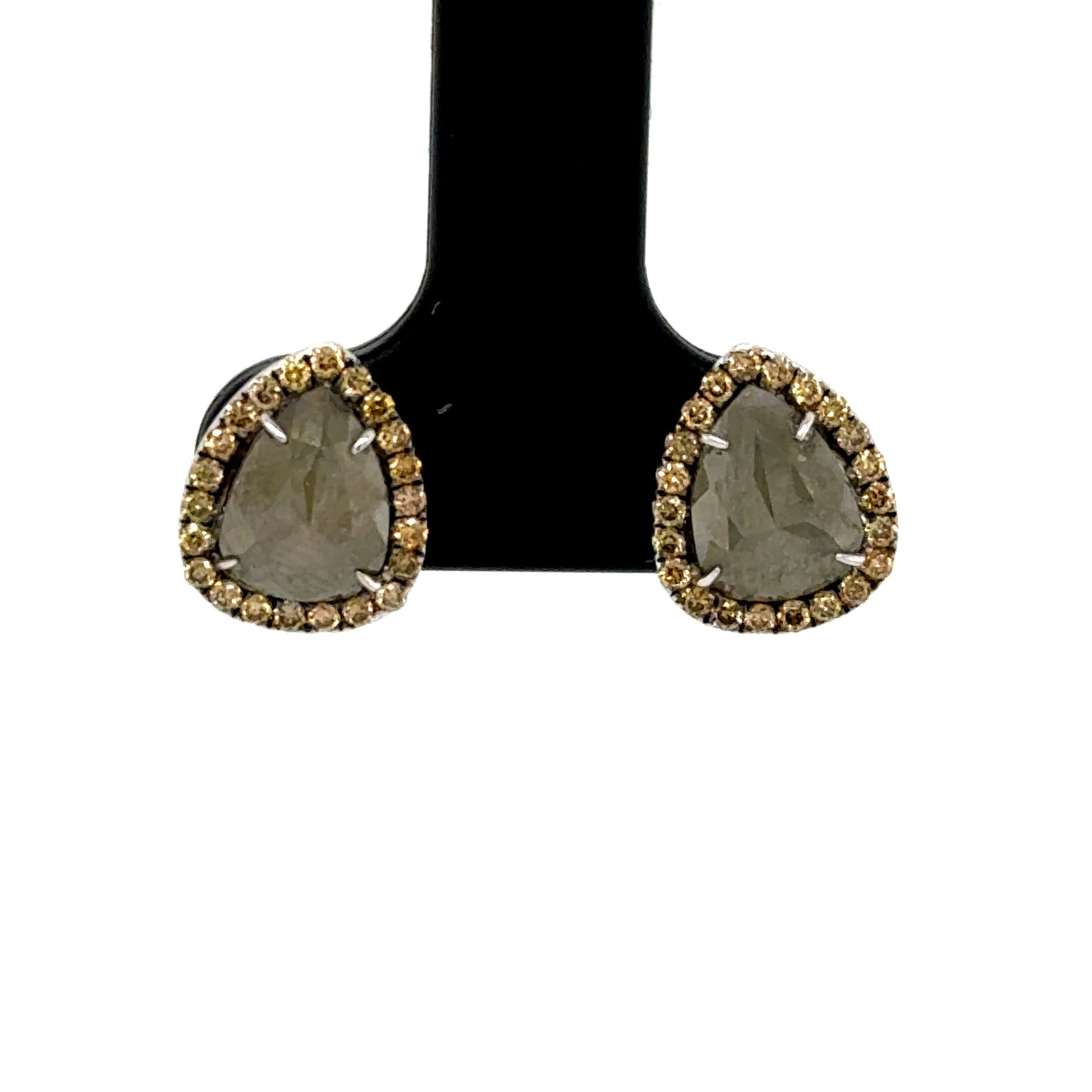 14K white gold stud earrings with pear-shaped slice diamonds and halo accents.