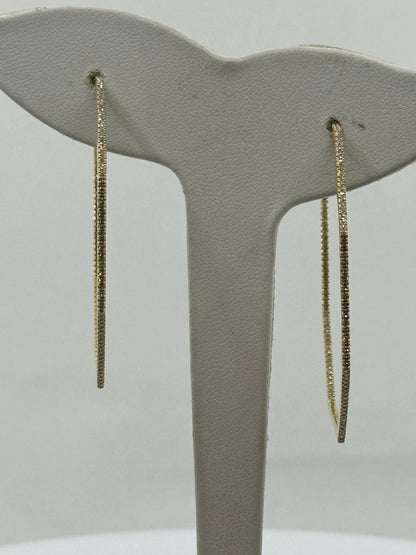 14K yellow gold large inside-out diamond hoop earrings with slender octagon shape.