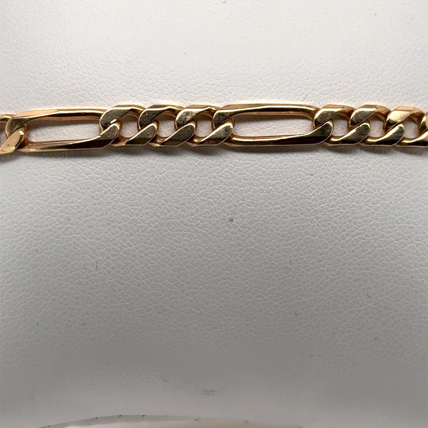14K yellow gold Figaro bracelet with alternating elongated and curb links.