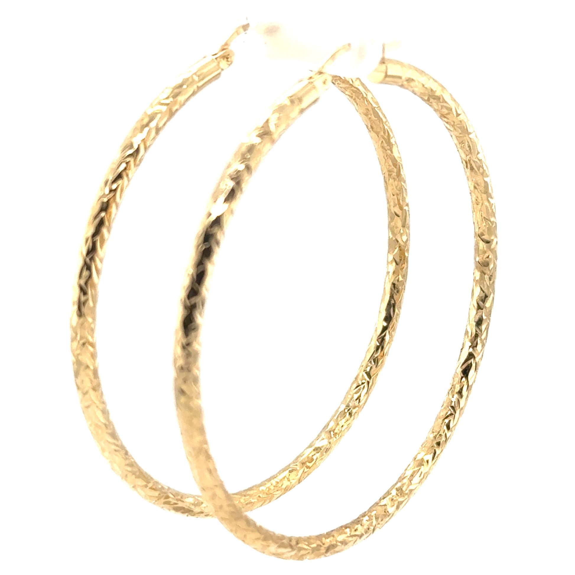Extra-large 14K yellow gold hoop earrings with diamond-cut textured tubing.