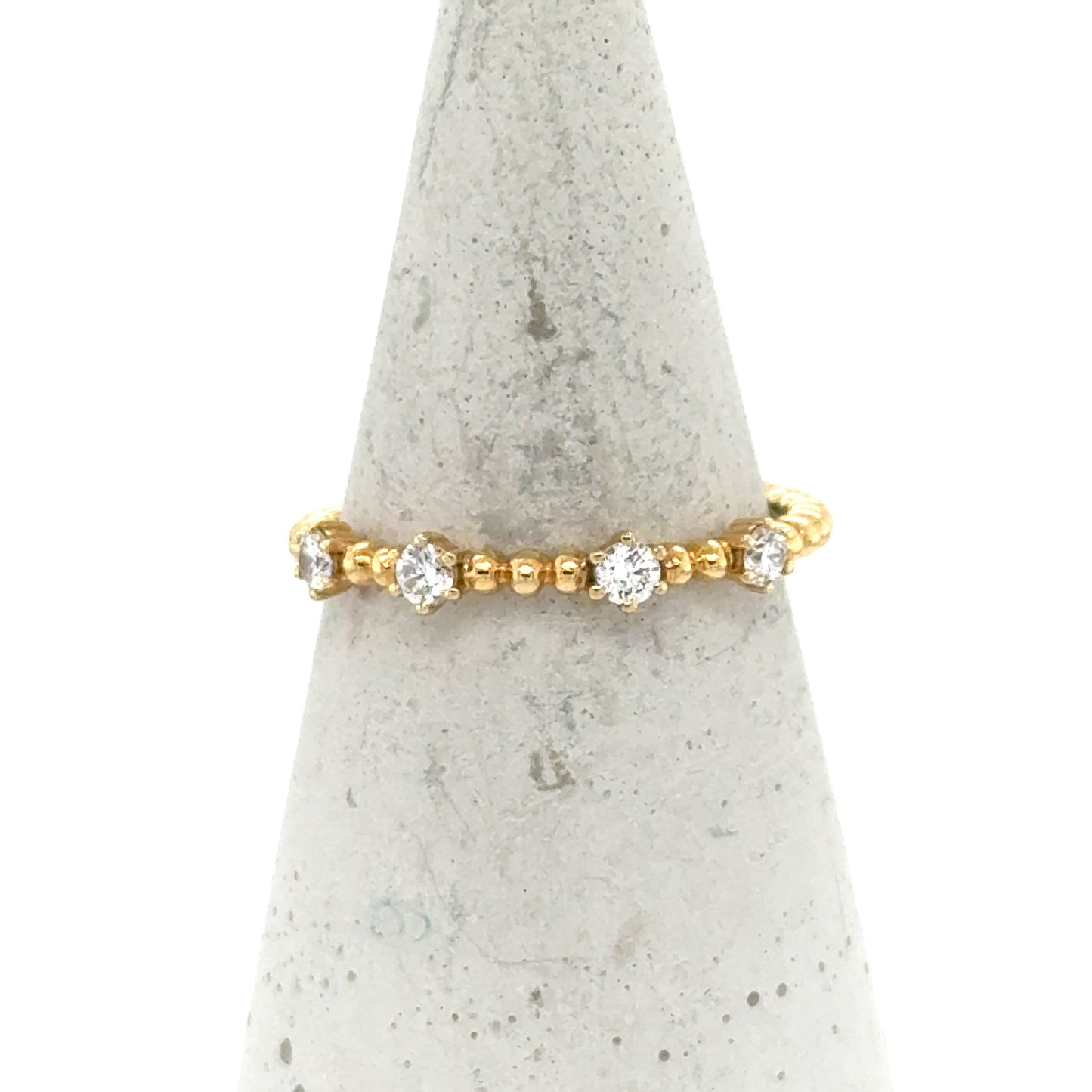 18K yellow gold beaded band with spaced round white diamond accents.
