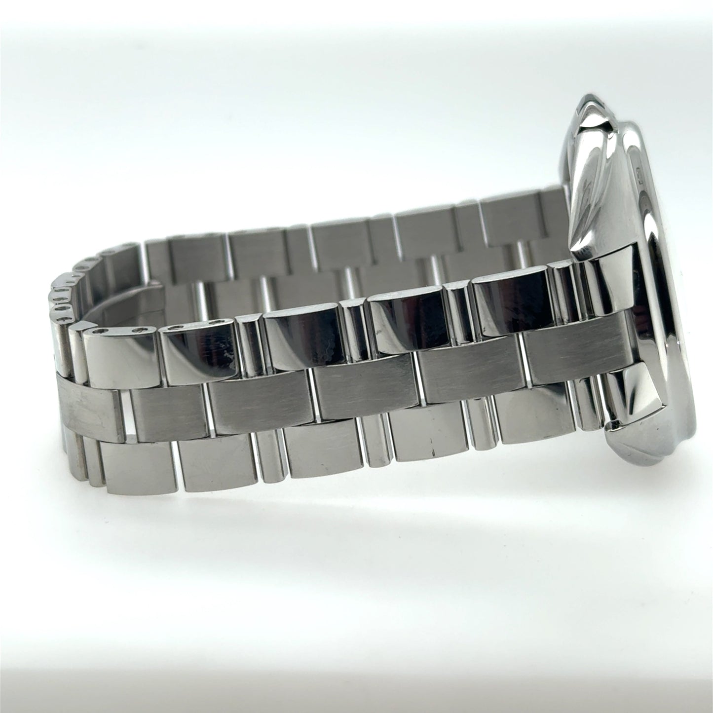 Stainless steel watch showing side profile with polished case and brushed link bracelet.