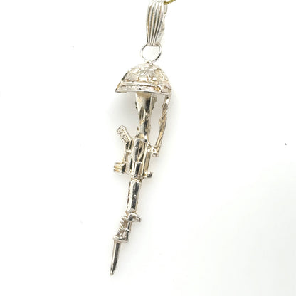 Sterling silver battlefield cross pendant with rifle, helmet, and textured bail.