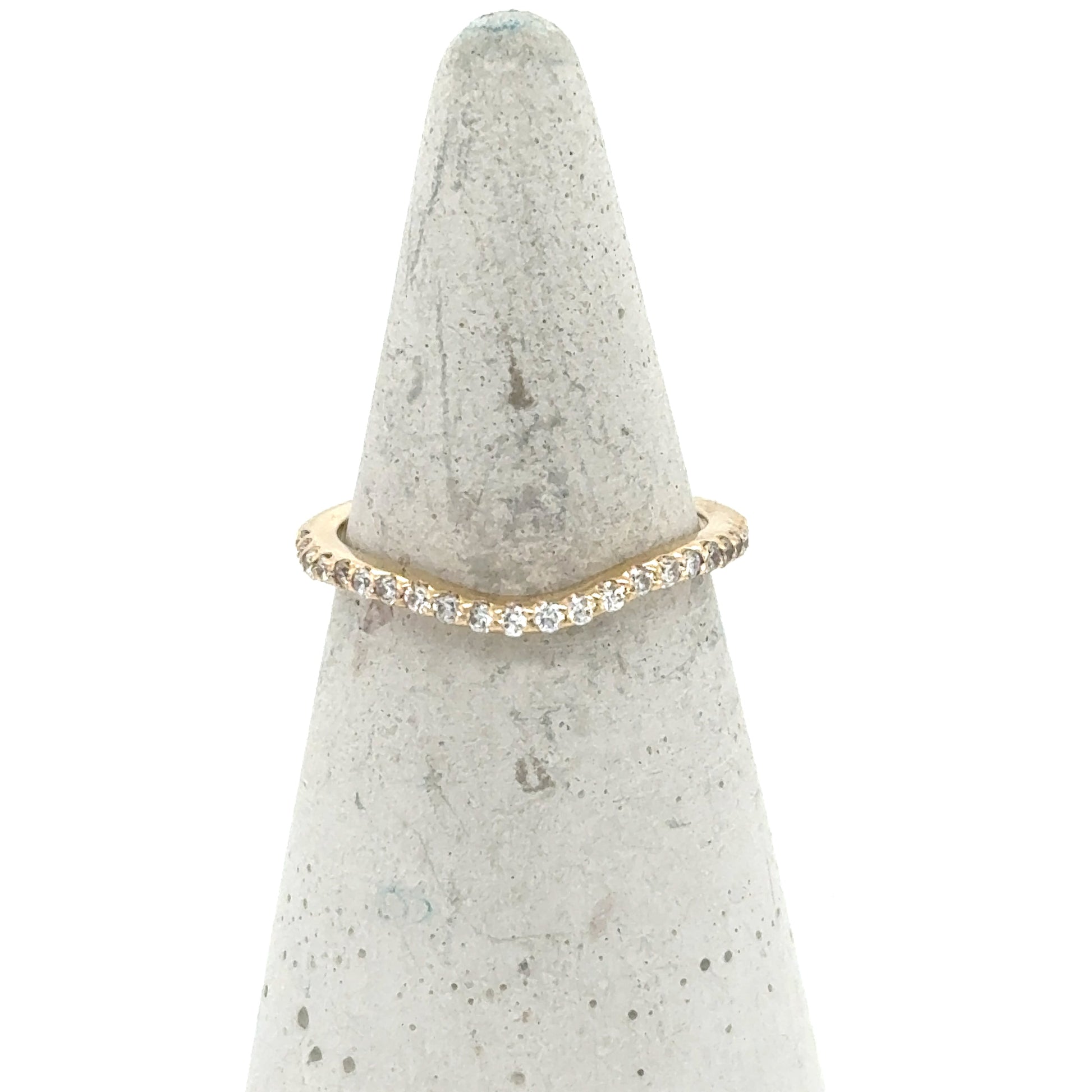 Curved 14K yellow gold band with a pavé row of round diamonds.