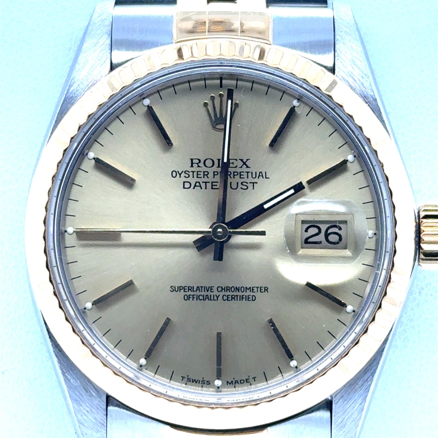 Two-tone Rolex Datejust 36mm with champagne dial, fluted gold bezel, date cyclops.