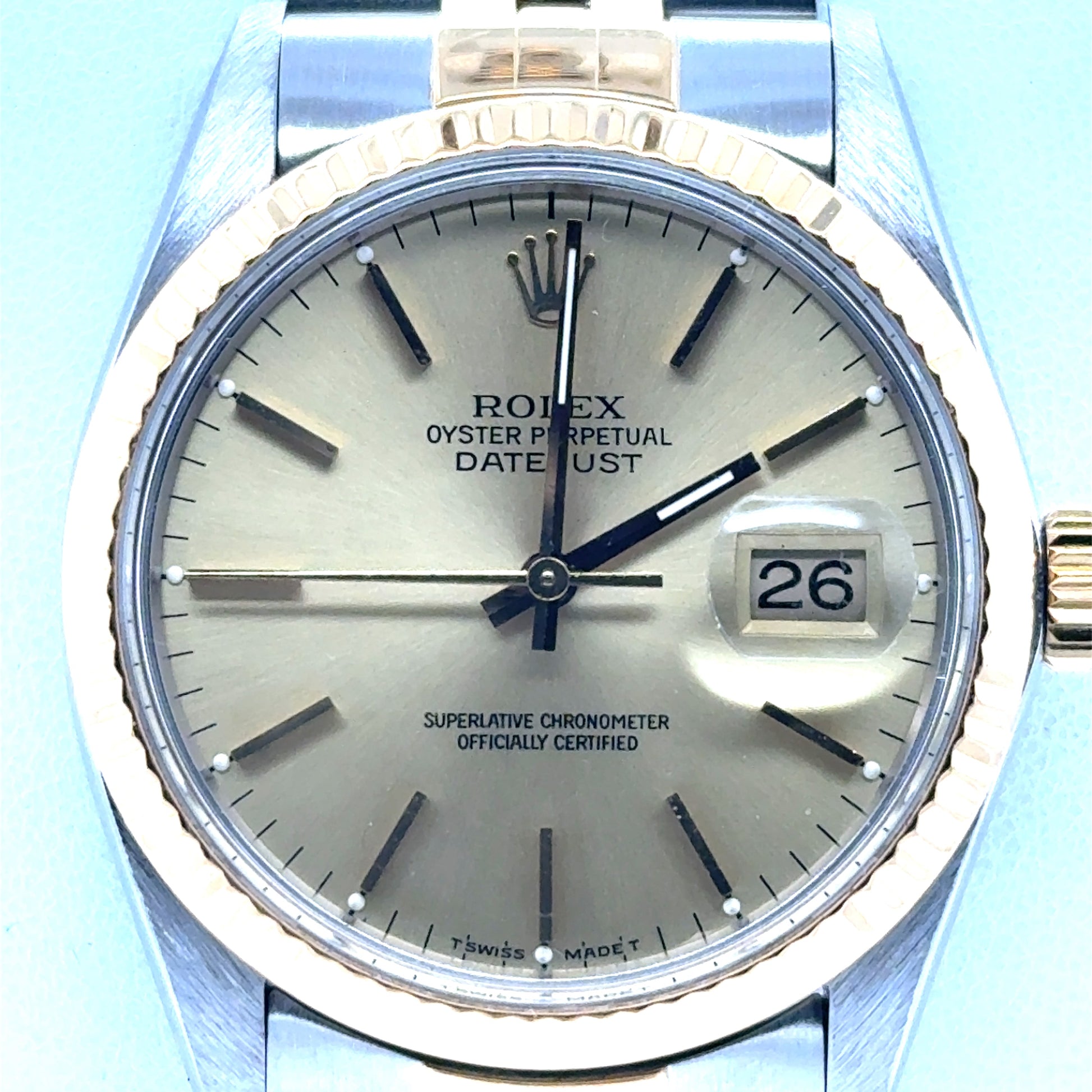 Two-tone Rolex Datejust 36mm with champagne dial, fluted gold bezel, date cyclops.