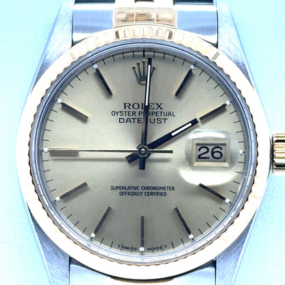 Two-tone Rolex Datejust 36mm with champagne dial, fluted gold bezel, date cyclops.
