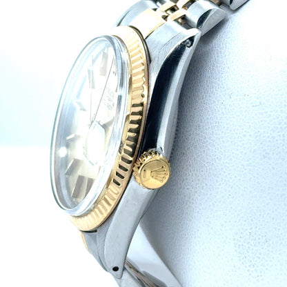 Two‑tone steel and yellow gold Datejust with fluted bezel, champagne dial, and Jubilee bracelet.