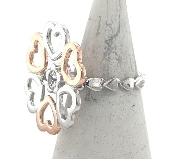 14K white and rose gold heart motif ring with bezel-set round diamond.