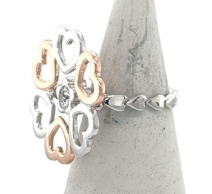 14K white and rose gold heart motif ring with bezel-set round diamond.