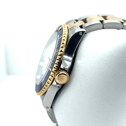 Two-tone steel and gold Submariner, blue bezel, gold crown, Oyster bracelet.